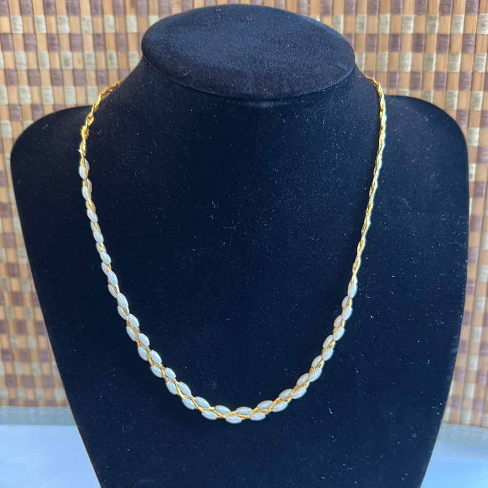 Women’s gold colored pearl like beads necklace.   16” in length.
